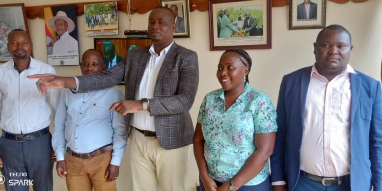 Kayunga LC 5 Chairman  Andrew Muwonge centre and Margret Nakavubu after the preparatory meeting of the ceremony