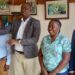 Kayunga LC 5 Chairman  Andrew Muwonge centre and Margret Nakavubu after the preparatory meeting of the ceremony