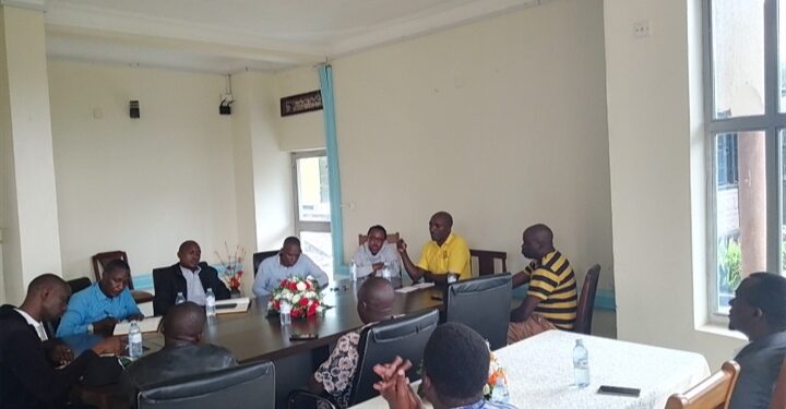 Umeme officials in an engagement meeting with locals