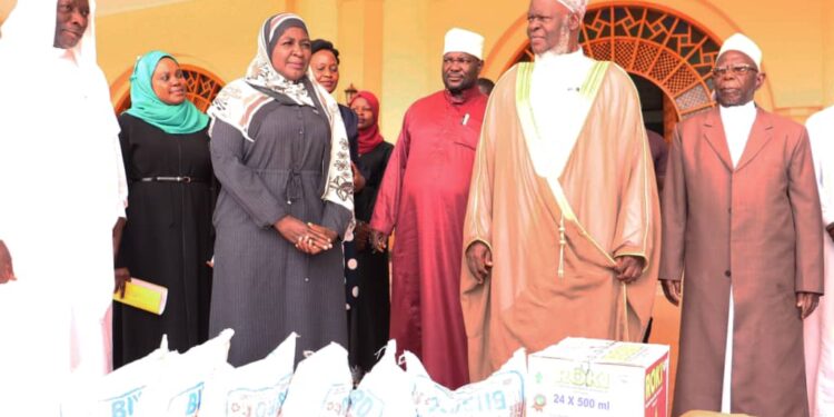 ONC Boss Hajjat Hadijjah Namyalo handing over food items to his Eminence the Mufti of Uganda Sheik Ramathan Mubaje yesterday