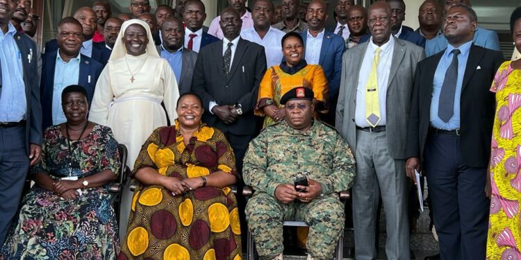 Minister Babalanda,  ISO  Deputy DG Lt Col Emmy Katabazi in a group photo with officials from the RDC Secretariat and RDCs/RCCs from Western Uganda