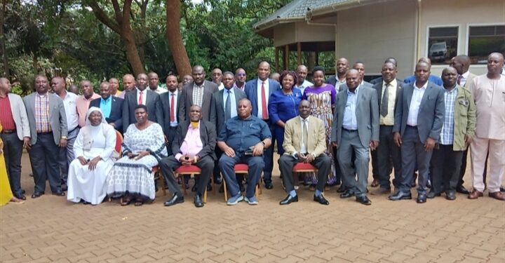 Hajji Yunus Kakande, Lt Col Emmy Katabazi,  RDC Secretariat Officials and RDCs/RCCs/DISOs in a group photo