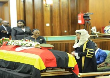 Speaker Among after laying a wreath on the coffin of the late Engola