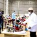 President Museveni interacts with tailoring students at Masaka regional industrial hub shortly after  commissioning the youths skilling  facility in Masaka on Wednesday