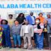 Hon. Kayagi (front row, 5th left) with committee members and stakeholders following a tour of Malaba Health Centre IV