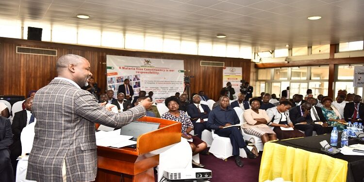 Tayebwa addresses participants at the dialogue on malaria