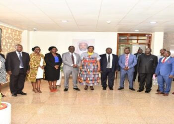 UHRC Chairperson, Mariam Wangadya (8th, right) and the Clerk to Parliament (9th, right) in a group photo after the report handover