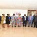 UHRC Chairperson, Mariam Wangadya (8th, right) and the Clerk to Parliament (9th, right) in a group photo after the report handover