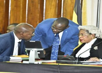 Speaker Among (R) confers with Deputy Attorney General, Hon. Jackson Kafuuzi and Finance State Minister, Hon. Amos Lugoloobi