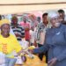 Hajjati Hadijjah Namyalo while handing over chicks and chicken feeds to people of Zirobwe