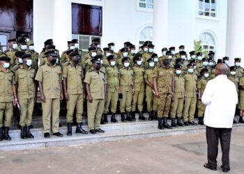 President Yoweri Museveni with CID officers at State House Entebbe