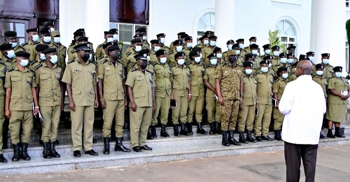 President Yoweri Museveni with CID officers at State House Entebbe