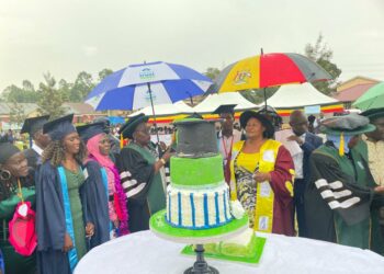 Minister Babalanda, Ahamed Seguya Memorial Technical Institute administrators and some of the graduands during the institution's graduation ceremony