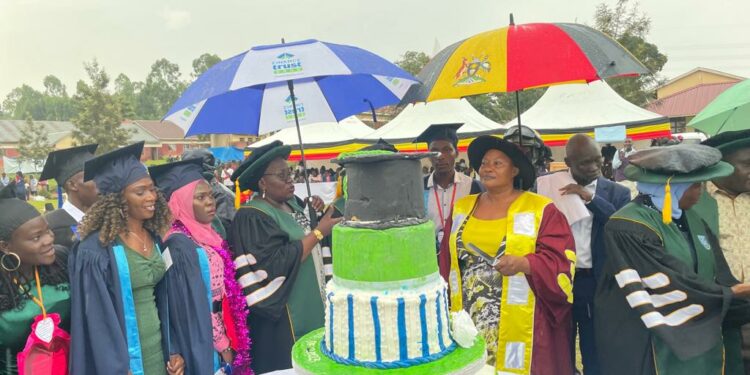 Minister Babalanda, Ahamed Seguya Memorial Technical Institute administrators and some of the graduands during the institution's graduation ceremony