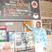 Charles Kirumira, the manager, Highway- Masaka, pointing at some of the drinks always asked for by customers. PHOTO BY BRIAN MUGENYI