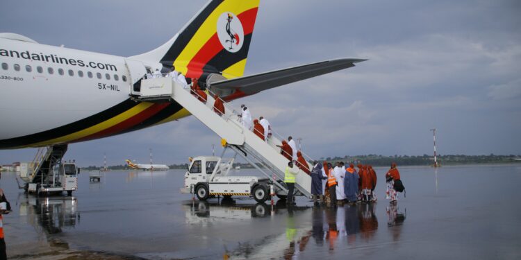 Pilgrims boarding Uganda Airlines