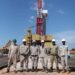 Earnest Rubondo (second right) poses for a photo with technicians and engineers on his arrival at the Jobi-Rii field, Tilenga Project on June, 7th 2023 (Photo @PAU)