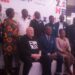 Minister of State for Finance, Amos Lugoloobi (Seated Centre) is flanked by PMI officials at Kampala Sheraton Hotel on Thursday