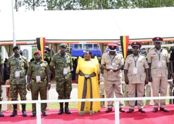 Some of the medalists pose for a photo with PM Nabanja after receiving their medals in Luwero on Friday. PPU Photo