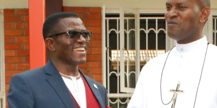 The katikkiro of Buganda Charles Peter Mayiga with Brother Augustine Mugabo, the head teacher St Henry's College Kitovu