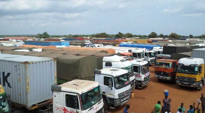 Trailers carrying goods from Uganda