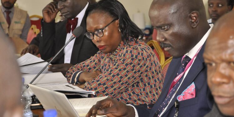 Bank of Uganda officials led by Mr. Twinemanzi appearing before MPs