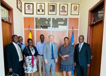 Dr. Nelson Musoba (extreme right) Hon. Babalanda (2nd right) and Mr. Richard Nelson in a group photo with other officials