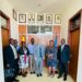 Dr. Nelson Musoba (extreme right) Hon. Babalanda (2nd right) and Mr. Richard Nelson in a group photo with other officials