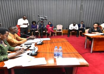 Committee chairperson, Hon. Ssenyonyi (2nd L) with his deput, Hon. Lucy Akello (L) in the meeting with officials from MSC