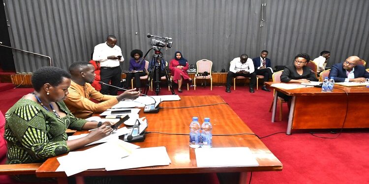 Committee chairperson, Hon. Ssenyonyi (2nd L) with his deput, Hon. Lucy Akello (L) in the meeting with officials from MSC