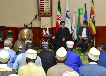 President Sayyid Ebrahim Raisolsadati of Iran (seated C) addresing the Muslim community during prayers at Old Kampala Mosque on Wednesday. Seated (L) is Mufti Shaban Mubajje. PPU Photo