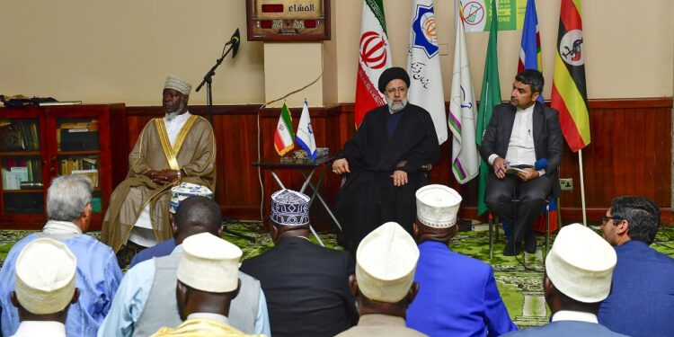 President Sayyid Ebrahim Raisolsadati of Iran (seated C) addresing the Muslim community during prayers at Old Kampala Mosque on Wednesday. Seated (L) is Mufti Shaban Mubajje. PPU Photo