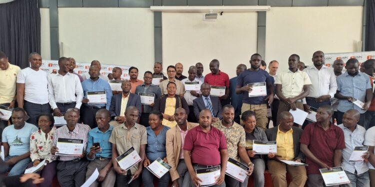 Minister Babalanda in a group photo with the training participants