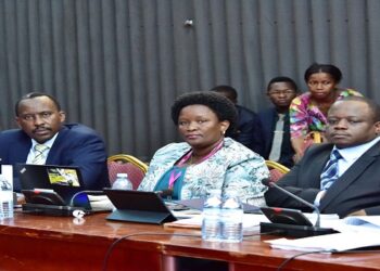 Commissioner General, Musinguzi (L) appearing before Cosase with other officials from URA