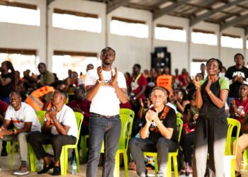 Apostle Grace Lubega leading his team to clap for Jesus