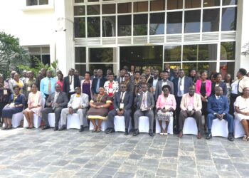 Minister Babalanda,  Hajji Yunus Kakande and Administrative Officers in a group photo.