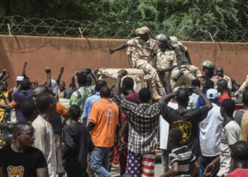 Masses join the mutinous soldiers to celebrate the ousting of President Mohamed Bazoum in Niamey,  Niger