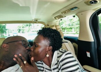 Minister Anite kissing her husband Allan Kajik