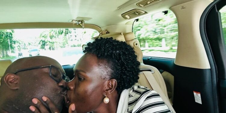 Minister Anite kissing her husband Allan Kajik