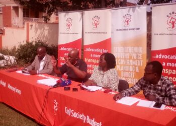 CSBAG Executive Director, Julius Mukunda (Centre) addressing Journalists in their Ntinda Kampala Head Office on Sunday