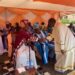 Catechist Jasper Onume greets Paramount Chief Eng Dr Michael Moses Odongo-Okune during the installation ceremony of Santo Angodo as the clan chief(awitong)of Bakocol in Lira City.