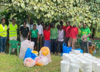 Members of a Community Forest Management group in Nyatonzi subcounty pose with their LC 3 Chairperson in the middle after receiving support and training for Bee Keep from the World Bank Group and Mac Bee trainers