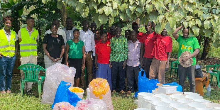 Members of a Community Forest Management group in Nyatonzi subcounty pose with their LC 3 Chairperson in the middle after receiving support and training for Bee Keep from the World Bank Group and Mac Bee trainers