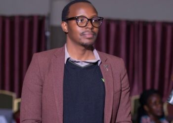 Asher Namanya the creator of the Cash Chat A.I at a recent event. He is also known for having created the Cash Chat App and grown it's usage across East Africa among other accolades to his name