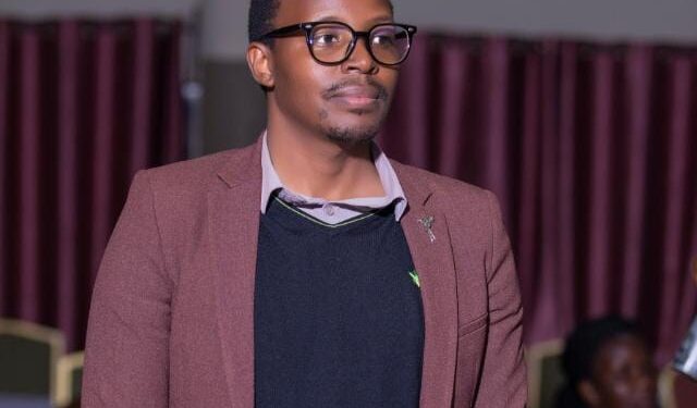 Asher Namanya the creator of the Cash Chat A.I at a recent event. He is also known for having created the Cash Chat App and grown it's usage across East Africa among other accolades to his name