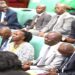 The leadership of the Committee on National Economy, Hon. John Bosco Ikojo (R) and Hon. Robert Migadde (2nd, R) seated with Ministers