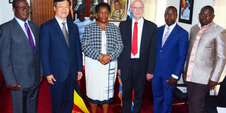 Minister Mutuuzo with Global Peace Festival delegates in her office in Kampala on Tuesday