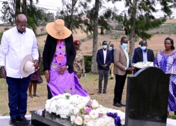 President Museveni and the First Lady laying a wreath on the grave of Canon Kabonero