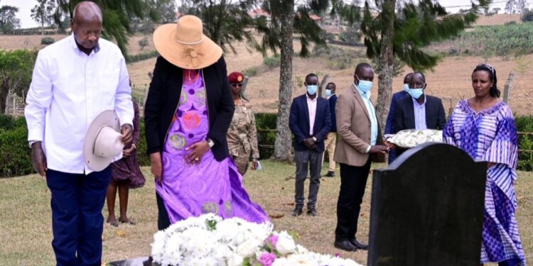 President Museveni and the First Lady laying a wreath on the grave of Canon Kabonero