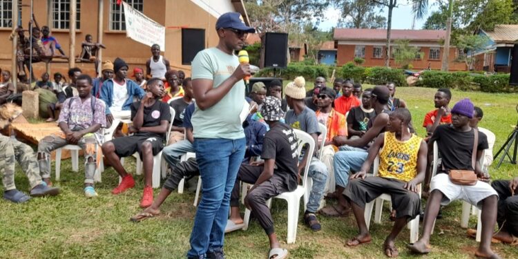 .Maj Emma Kutesa Presidential Assistant Special operations State House during a meeting with ghetto boys at St John SS,Wakitaka,Northern Division,Jinja City.